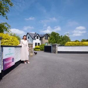 Photo of Fiona in front of house